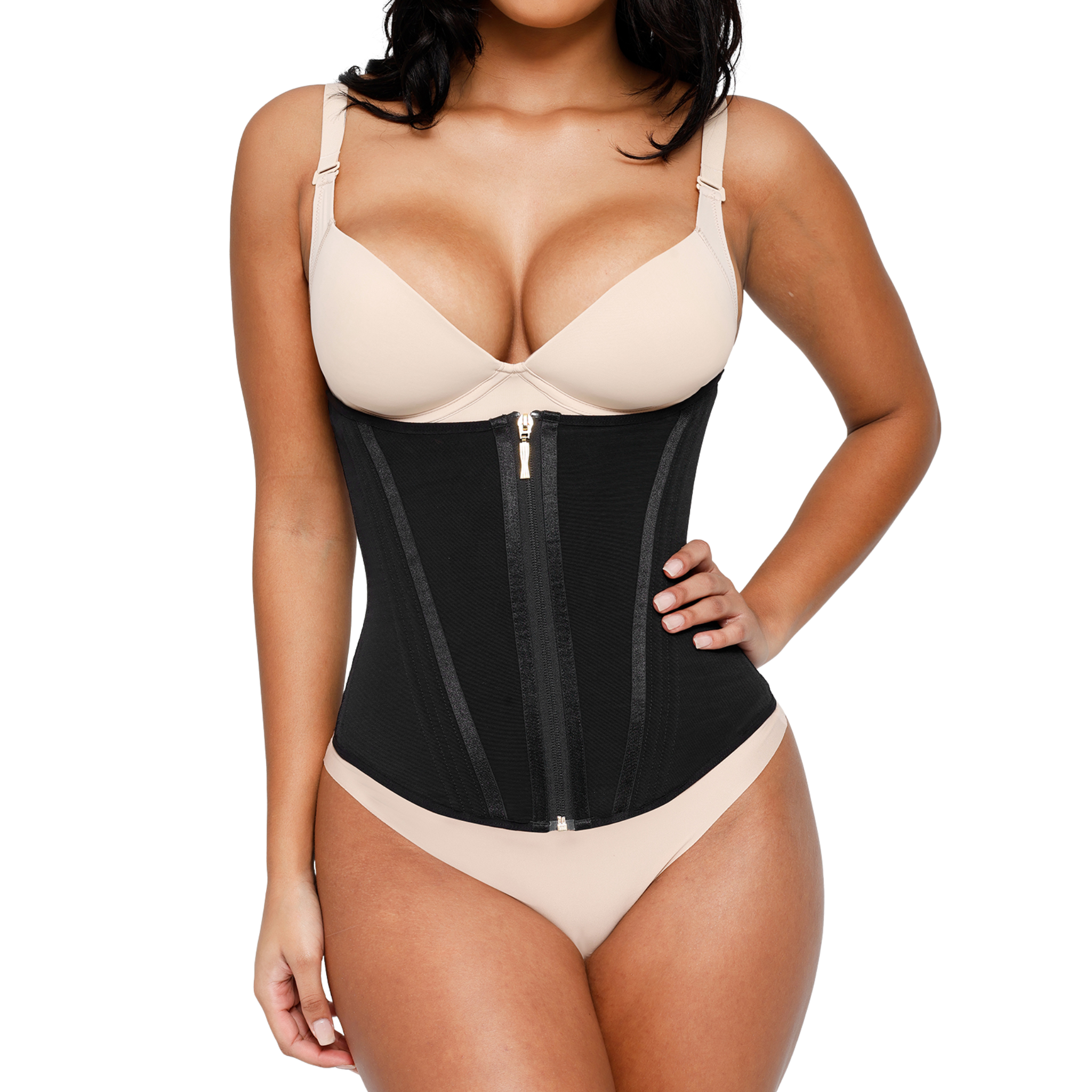Woman wearing a black waist trainer with beige bra and underwear on a white background